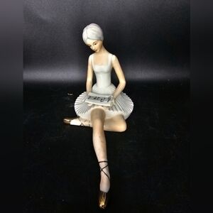 COPY - Vintage porcelain resting ballerina reading‎ musical notes